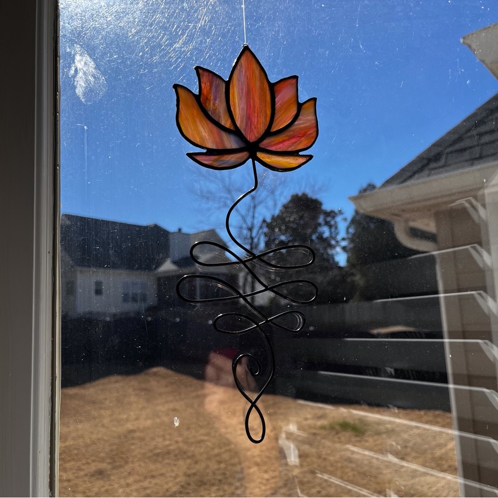 Handmade, hand cut Stained Glass Unalome by Jaggedglassworks